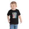 toddler-staple-tee-black-front-69696e6fcc875.jpg My Story - Toddler Short Sleeve Tee
